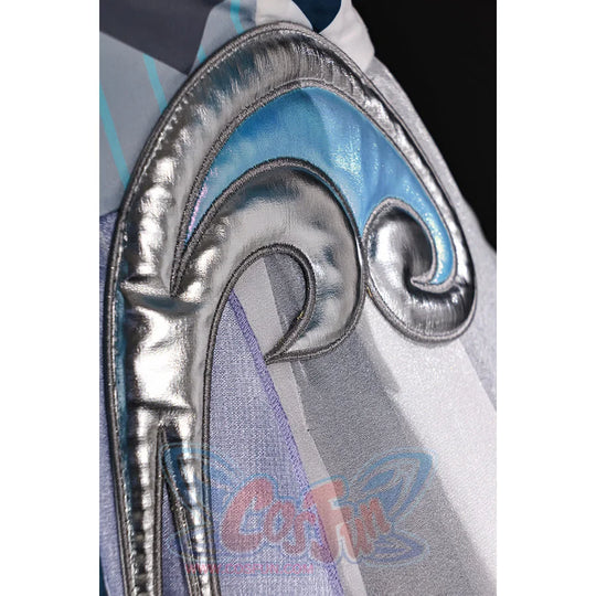 Vodyanitsa cosplay costume trim detail with raised silver-tone scrollwork beside pale blue and gray layers.