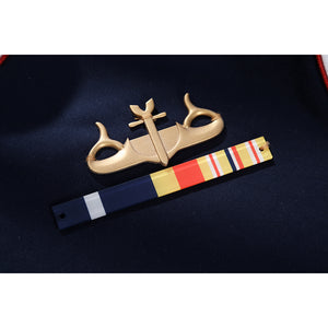 The Boys Torpedo cosplay chest badge detail places medal bars under a gold-tone uniform emblem.
