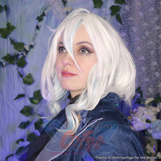 Genshin Impact Furina cosplay wig frames blue-highlighted white waves beside a jacquard high-collar jacket and gray scarf.