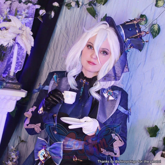 Genshin Impact Furina cosplay jacket sets ornate blue trim over a black shirt anchored by a purple-blue mini top hat.