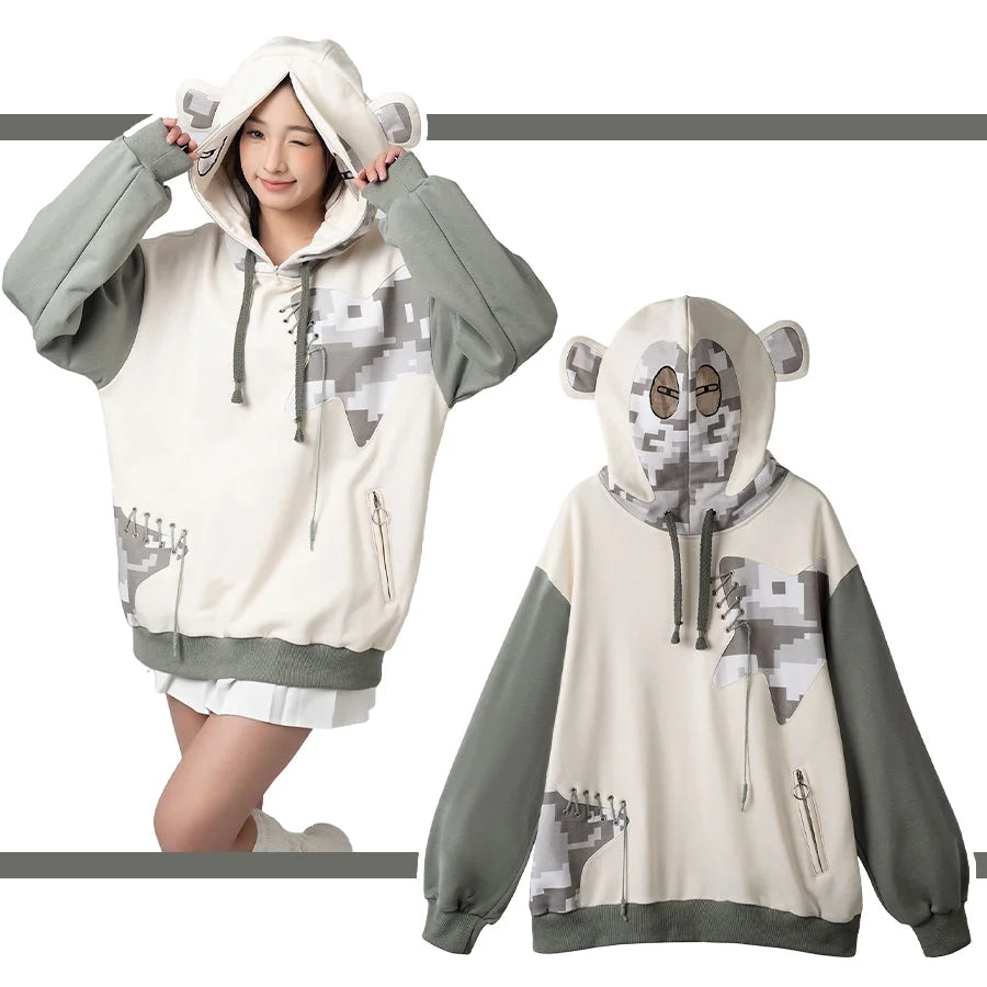 Person wearing adorable gorilla Full Zip Hoodie with gray sleeves and white body, playfully holding hood ears
