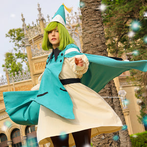 Witch Hat Atelier Coco cosplay costume action view sends the teal cloak flowing behind a cream pleated robe.