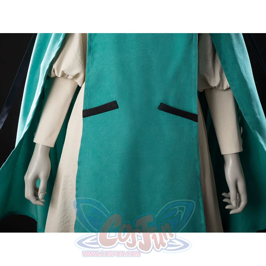 Witch Hat Atelier Coco Tetia Richeh cosplay cloak front detail drops teal fabric beside cream sleeves.