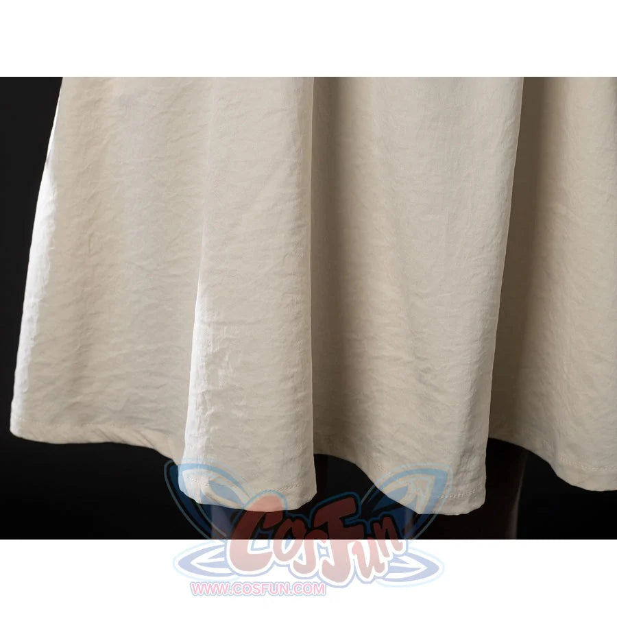 Witch Hat Atelier Coco Tetia Richeh cosplay robe hem close-up forms soft cream folds along the lower skirt edge.