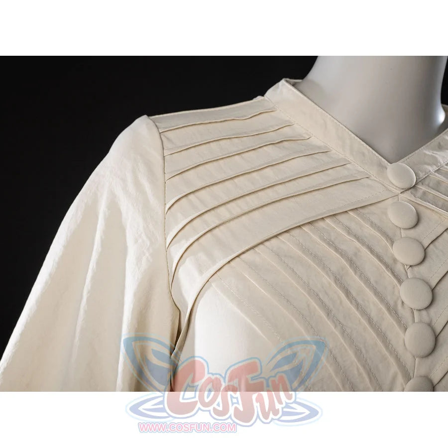Witch Hat Atelier Coco Tetia Richeh cosplay robe shoulder detail folds cream pleats beside covered buttons.