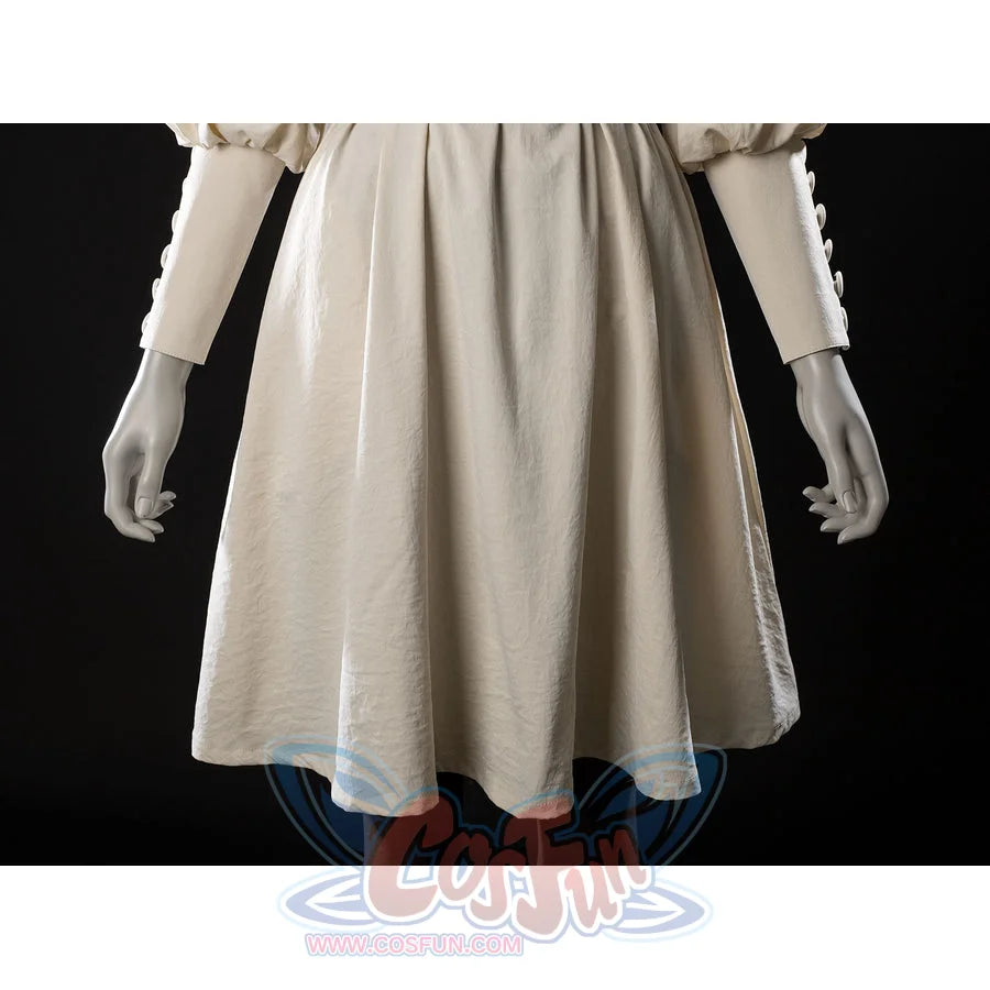 Witch Hat Atelier Coco Tetia Richeh cosplay robe skirt detail falls in soft cream folds below the black waist sash.