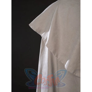 Witch Hat Atelier Qifrey cosplay cape edge detail folds cream fabric into a pointed shoulder layer.