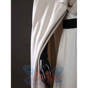 Witch Hat Atelier Qifrey cosplay cape side detail lets a cream panel fall beside the black sleeve.