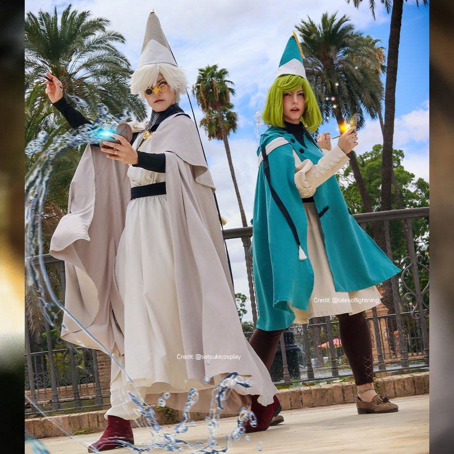 Witch Hat Atelier Qifrey and Coco cosplay costumes pair pale and teal capes over matching apprentice robes.