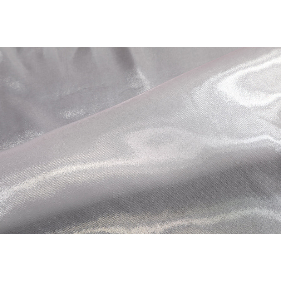 Wuthering Waves Aemeath cosplay glossy satin detail highlights smooth white fabric with soft reflective folds.