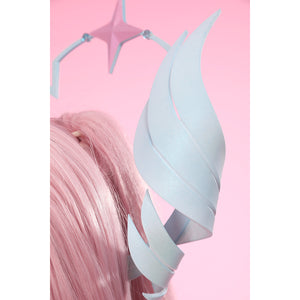 Wuthering Waves Aemeath cosplay headpiece wing detail curves pale blue feather shapes beside the star arc.