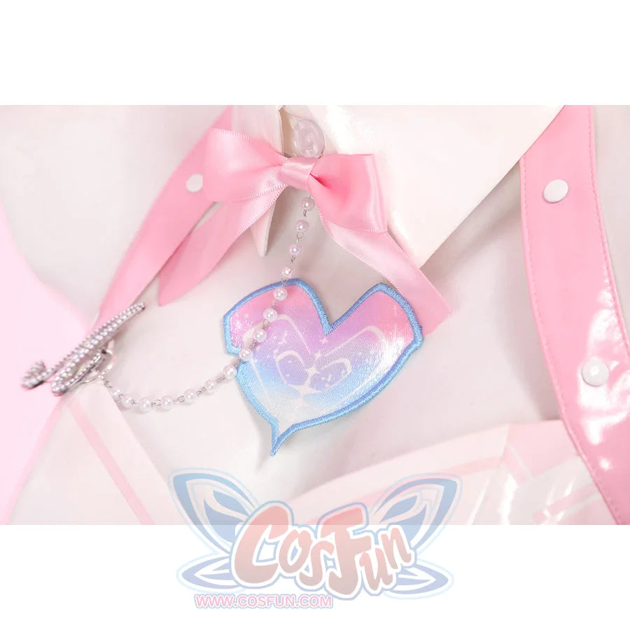 Wuthering Waves Aemeath cosplay heart patch detail sits below a pink bow tie, framed by glossy straps and chain.