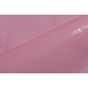 Wuthering Waves Aemeath cosplay pink glossy panel detail reflects light across a soft strap or bow material.