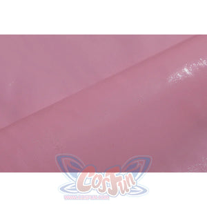 Wuthering Waves Aemeath cosplay pink glossy panel detail reflects light across a soft strap or bow material.