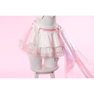 Wuthering Waves Aemeath cosplay side-waist bow falls over the skirt in pink gauze, silver-tone chain, and long ribbon tails.