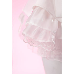 Wuthering Waves Aemeath cosplay skirt hem close-up layers glossy ruffles over embroidered lace and soft pink mesh.