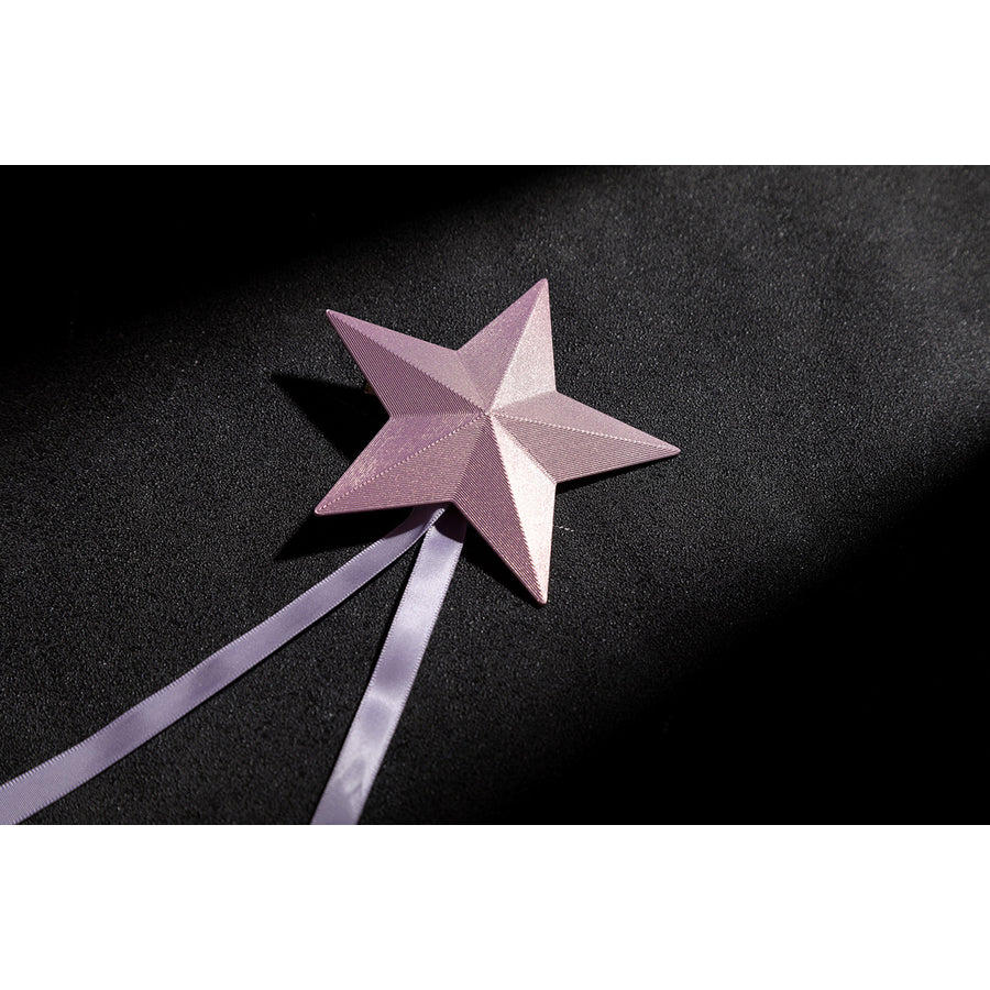 Wuthering Waves Aemeath cosplay star hair tie detail sets a folded pink star above long ribbon tails.