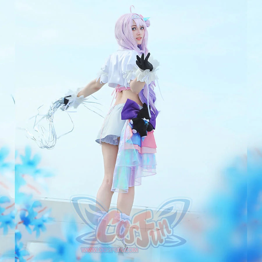 Wuthering Waves Denia cosplay costume side view frames the skirt shorts with a black bear plush and iridescent ribbon.