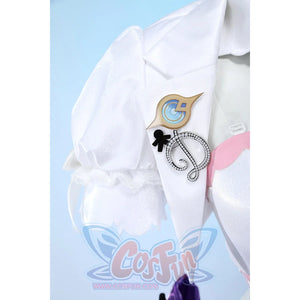 Wuthering Waves Denia cosplay sleeve brooch detail pins gold-tone buttons and charms beside white puff fabric.
