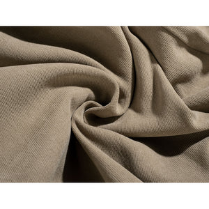 Yoda Master cosplay costume layers soft beige knit fabric in deep flowing folds to frames the texture of the material.