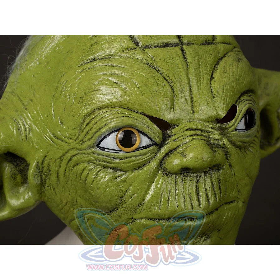 Yoda Master cosplay headpiece and claws curve across wrinkled green latex facial pairs with realistic gold-tone eyes.