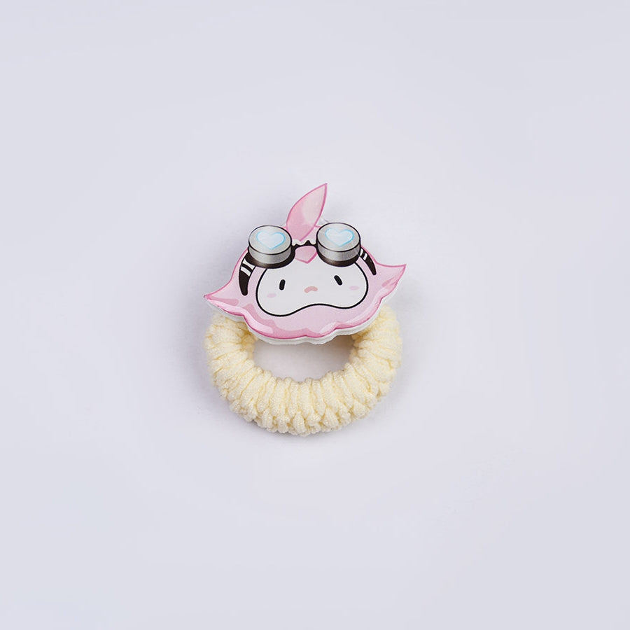 1883 Science and Medium Yongchu Taffy cosplay costume hair accessory centers a pink character charm above a yellow band.