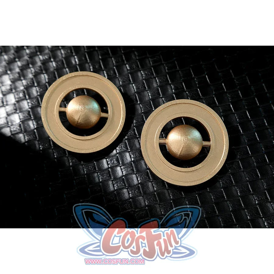 Zenless Zone Zero Dialyn cosplay earrings close-up shows gold-tone circular pieces on black textured fabric