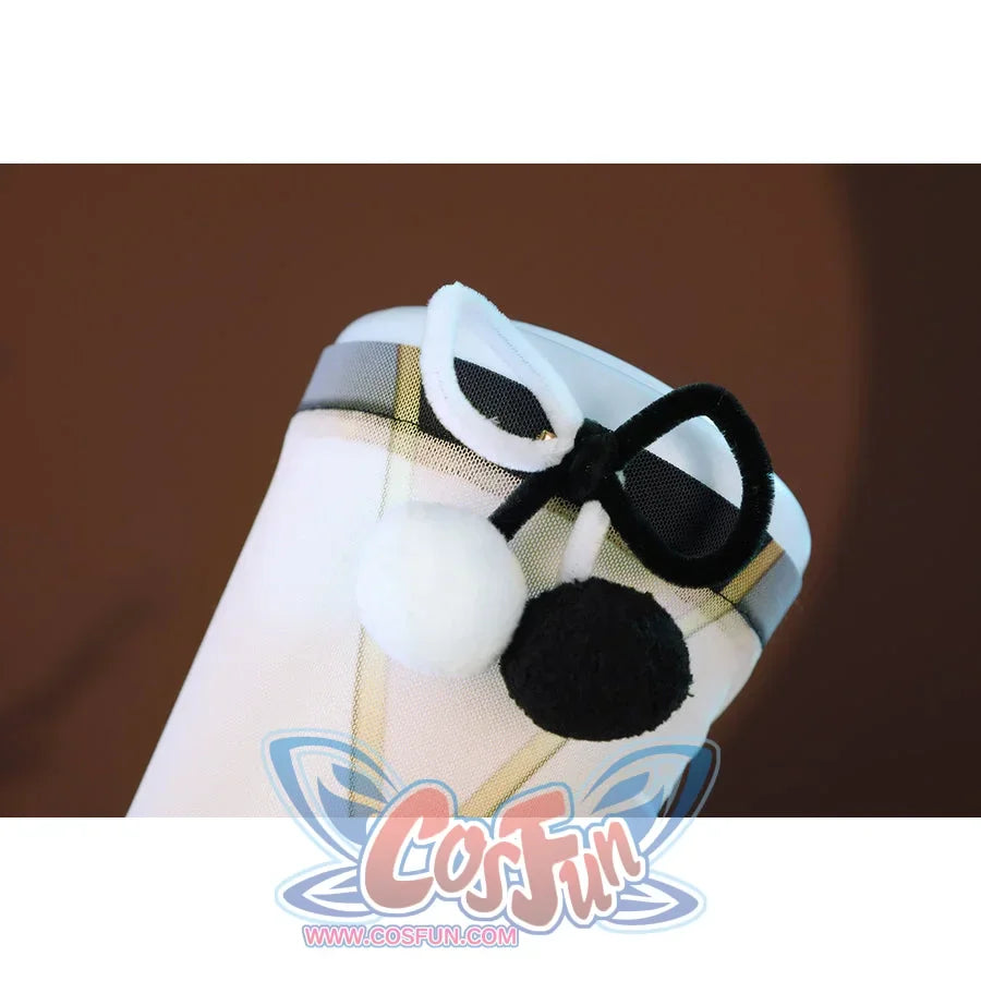 Zenless Zone Zero Dialyn cosplay legwear strap detail shows black and white pom accents over white fabric