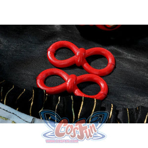 Zenless Zone Zero Dialyn cosplay red loop accessory detail rests on black plush trim and dark fabric
