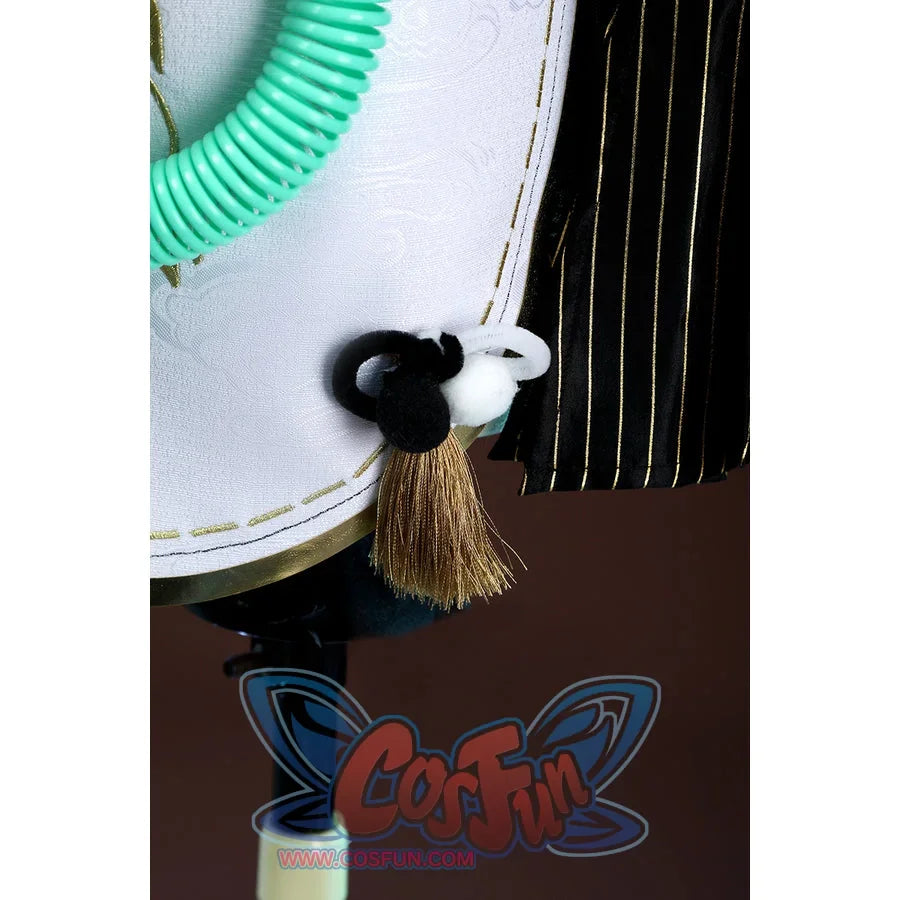 Zenless Zone Zero Dialyn cosplay side tassel detail hangs a brown tassel below black and white pom accents