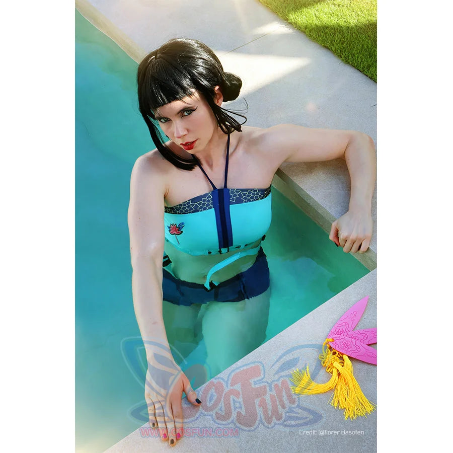 Zoey cosplay tankini angled swim view sets a teal halter top above navy shorts and turquoise straps.