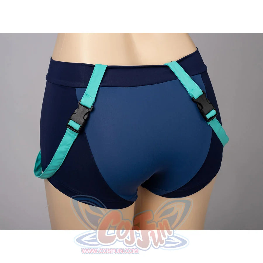 Zoey cosplay tankini back shorts detail sets navy fabric under turquoise harness straps.