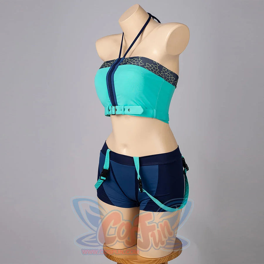 Zoey cosplay tankini side view balances a teal halter top, navy shorts, and clipped hip straps.